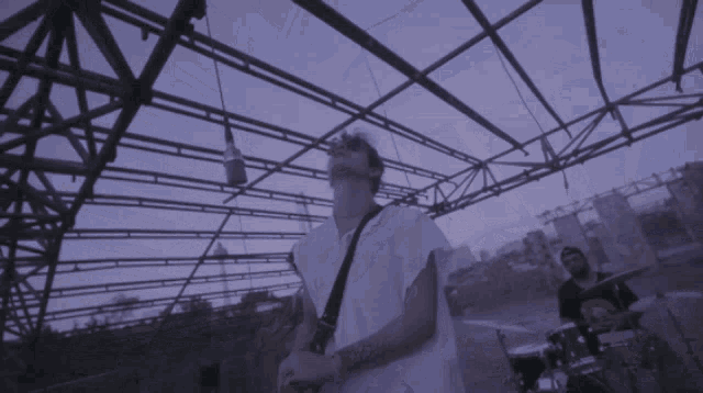 a blurry picture of a person playing a guitar