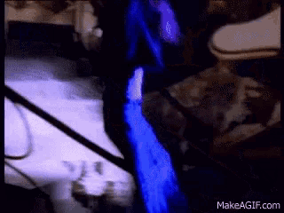 a blue light is coming out of a hole in the wall