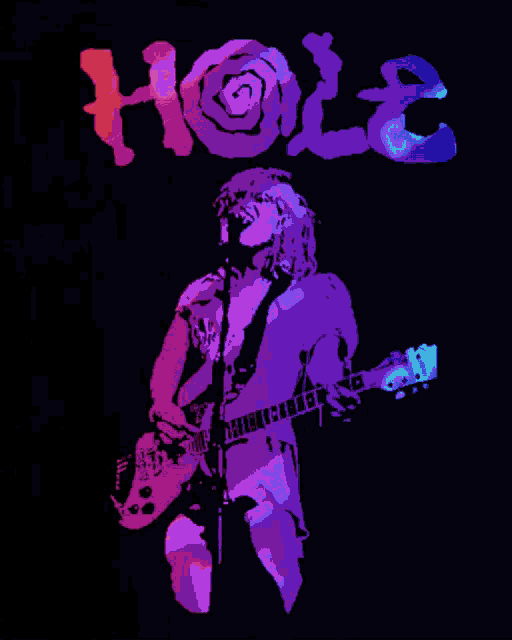 a man singing into a microphone while holding a guitar with the word hole behind him