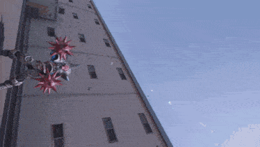 a robot with spikes on its head is standing in front of a tall building