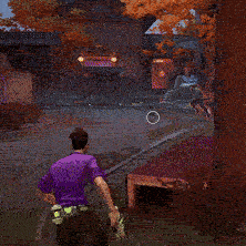 a man in a purple shirt playing a video game