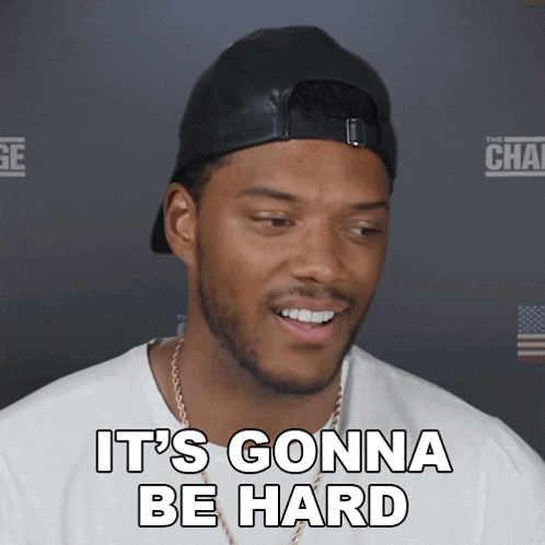 a man wearing a black hat and a white shirt says it 's gonna be hard