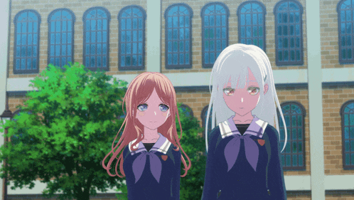 two anime girls standing in front of a building
