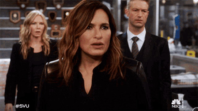 a group of people standing in front of a sign that says #svu on it