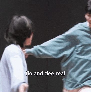 a man and a woman are fighting with the words fio and dee real in the background