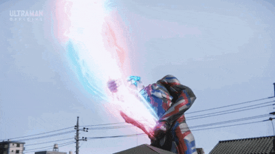 a man in a red , white and blue costume is standing on top of a building .