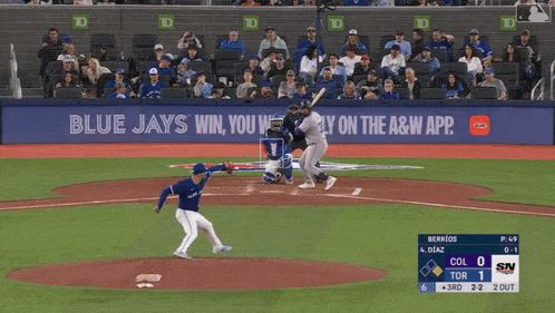 a blue jays baseball game is being played in front of a banner that says blue jays win you win