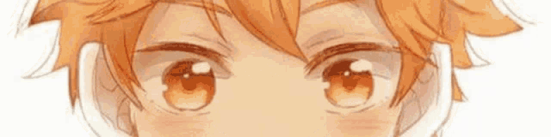 a close up of a child 's eyes with orange hair .