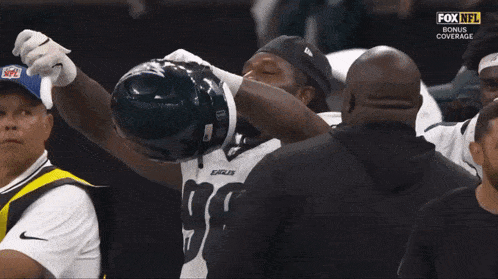 a fox nfl broadcast of a football game with eagles players on the field