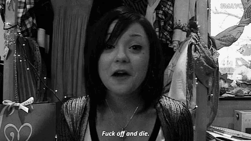 a woman says " fuck off and die " in front of a closet