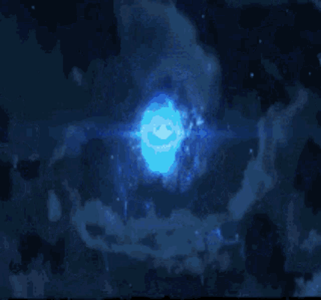 a blue glowing object in the middle of a blue galaxy