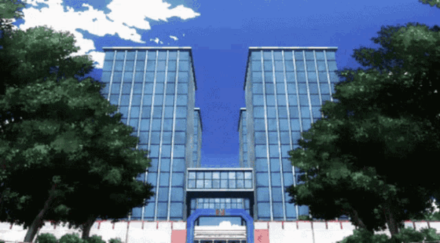 a large building with a blue sky and trees in front of it