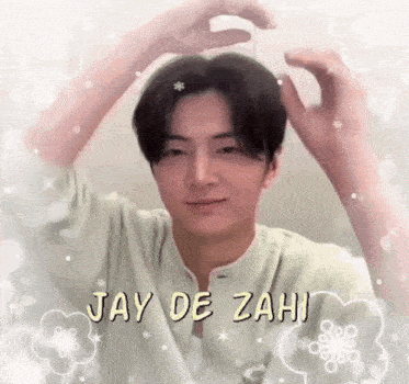 a man is making a heart with his hands in his hair .