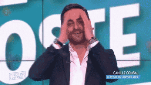 a man in a suit is covering his face with his hands in front of a sign that says ' camille combal '