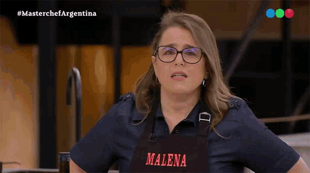 a woman wearing glasses and an apron that says malena on it