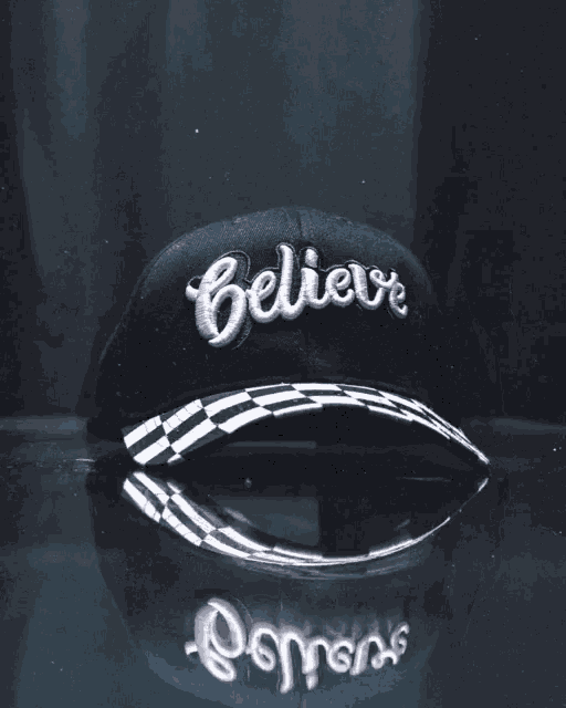 a black hat that says believe on it