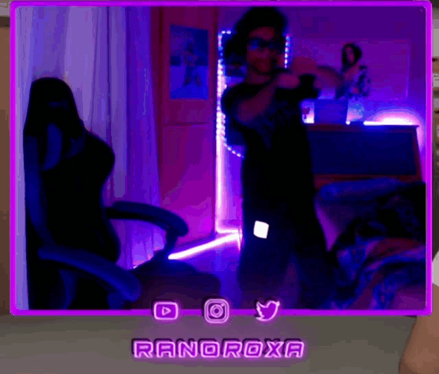 a man is dancing in a room with purple lights and the name ranoroxa on it
