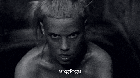 a black and white photo of a woman with sexy boys written on the bottom