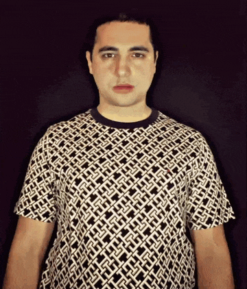 a man is wearing a black and white shirt with a pattern