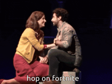 a man and a woman on a stage with the words hop on fortnite