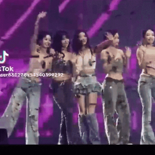 a group of women are dancing on a stage with a tiktok watermark