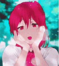 a girl with red hair has her hands on her face .