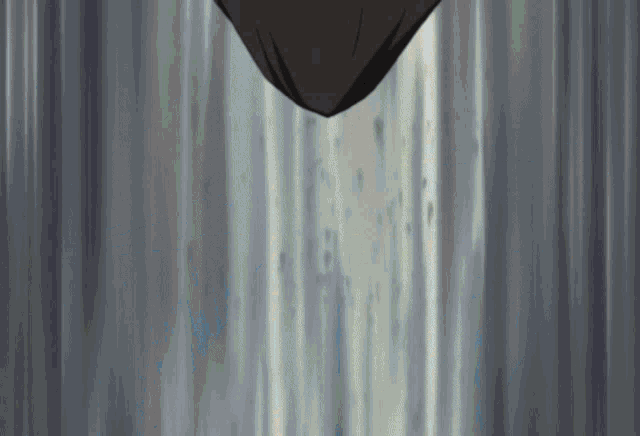 a gray curtain with a few spots of water on it