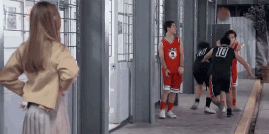 a group of basketball players one of whom is wearing a number 10 jersey