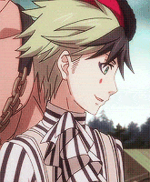 a close up of a person 's face with a striped shirt on