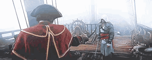 a man in a red cape is standing next to a man in a black hat .