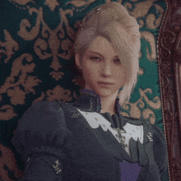 a woman with blonde hair is sitting in a chair with a green pillow