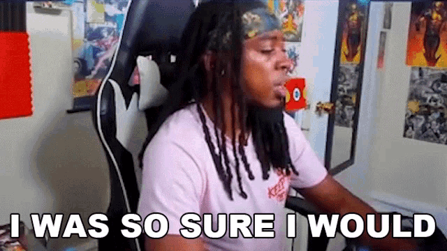a man with dreadlocks is sitting in a chair and saying `` i was so sure i would `` .