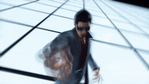 a blurry picture of a man in a suit walking