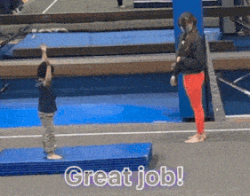 a little boy is standing on a mat with the words great job on it