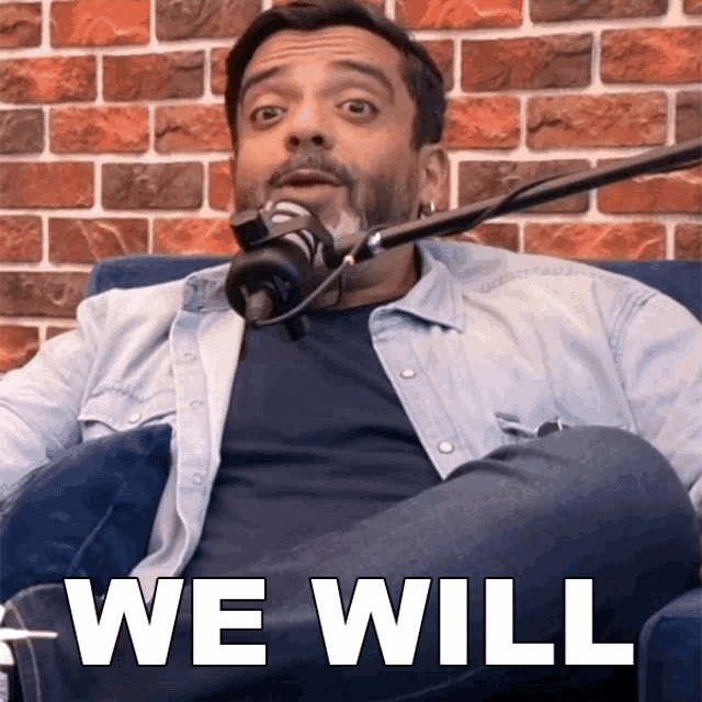 a man sitting in front of a microphone with the words " we will " on the bottom right