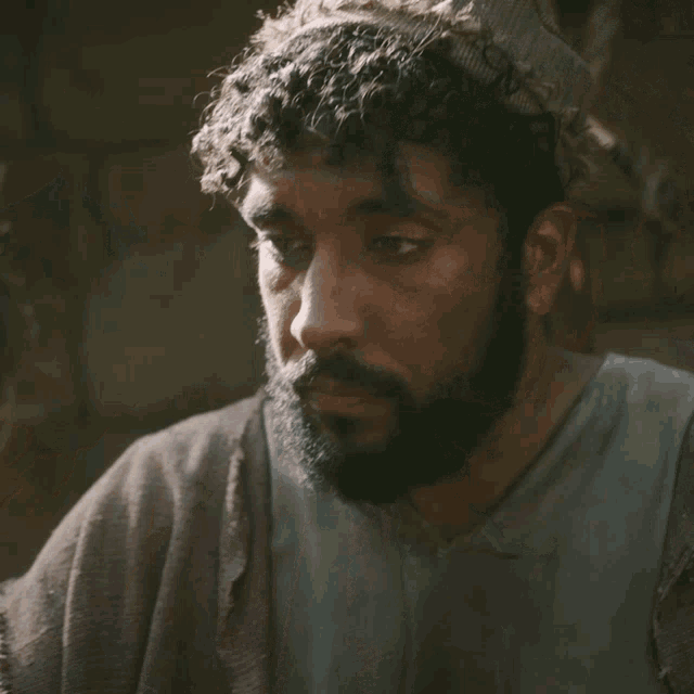 a man with a beard looks at a woman
