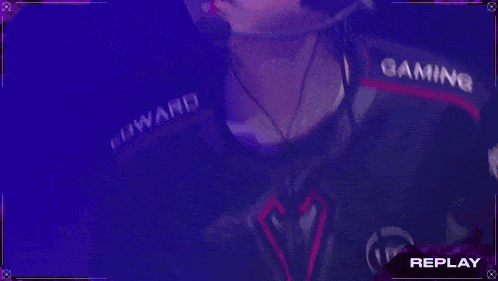 a man wearing a headset with replay written on the bottom right