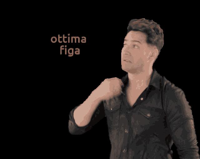 a man in a black shirt is standing in front of a black background with the words optima figa above him