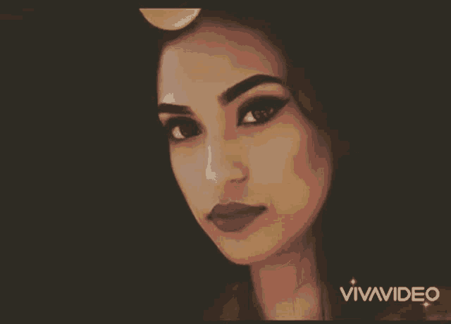a close up of a woman 's face with the word vivavideo below it