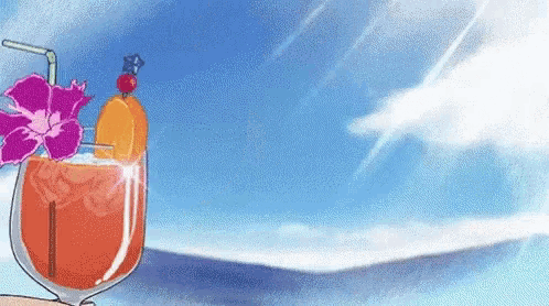 a glass of orange juice with a straw and a flower on top is sitting on a table .