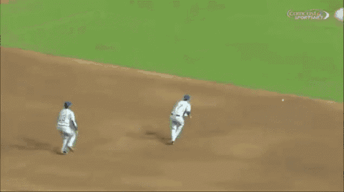 two baseball players are running on a field and one has the number 2 on his jersey