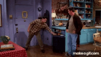 a make a gif.com page shows two men standing in a kitchen