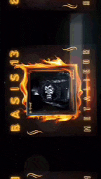 a close up of a clock with flames and numbers on it