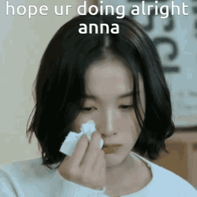 a woman is crying while holding a napkin in her hand with the words hope ur doing alright anna written above her