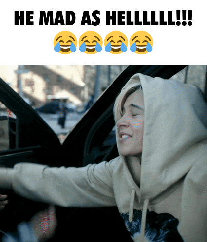 a woman in a hooded sweatshirt is sitting in a car with the caption he mad as helllll