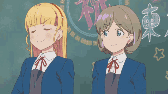 two anime girls are standing in front of a blackboard with chinese writing