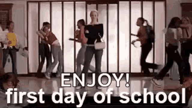 a group of young women are dancing in a hallway .