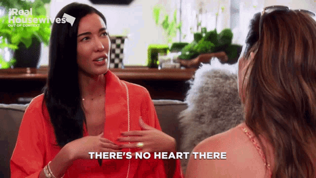 two women sitting on a couch with the words there 's no heart there