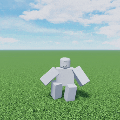a white robot with a smile on his face is standing in the grass