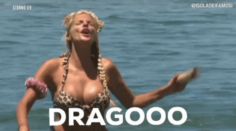 a woman in a leopard print bikini is standing in the water and says dragooo